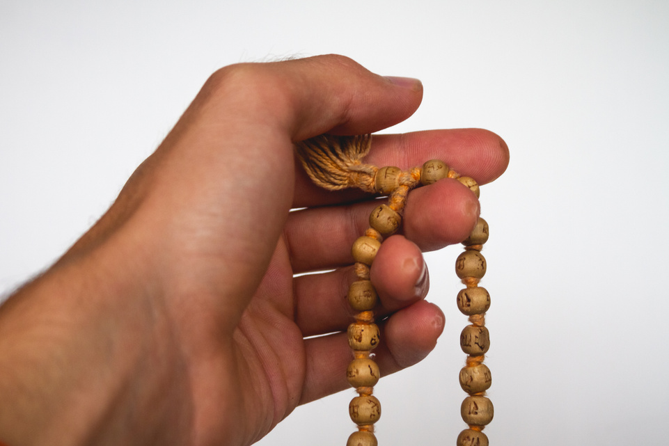 Hand meditation on Japa Mala Tulsi wooden Beads
